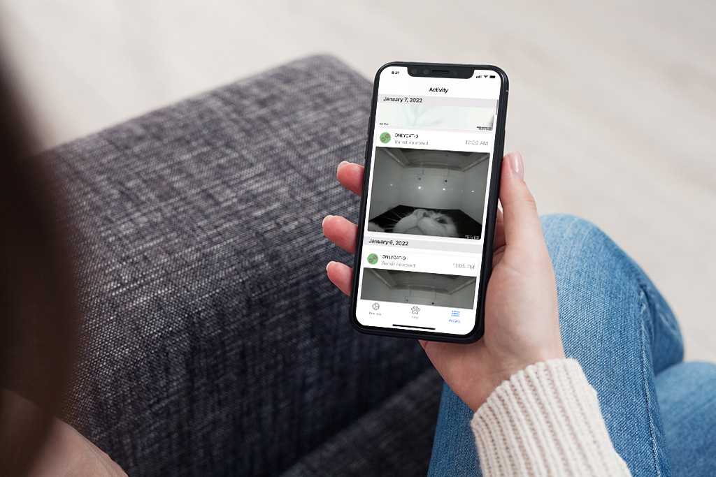 Woman using OnlyCat App